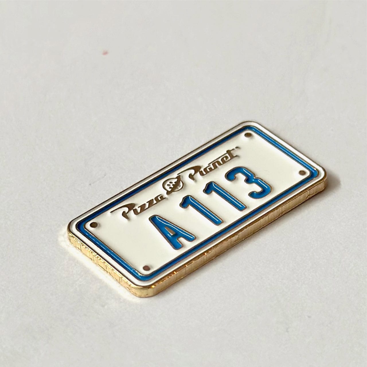 Pinbuds Enamel pin A113 license plate pizza planet easter egg pin