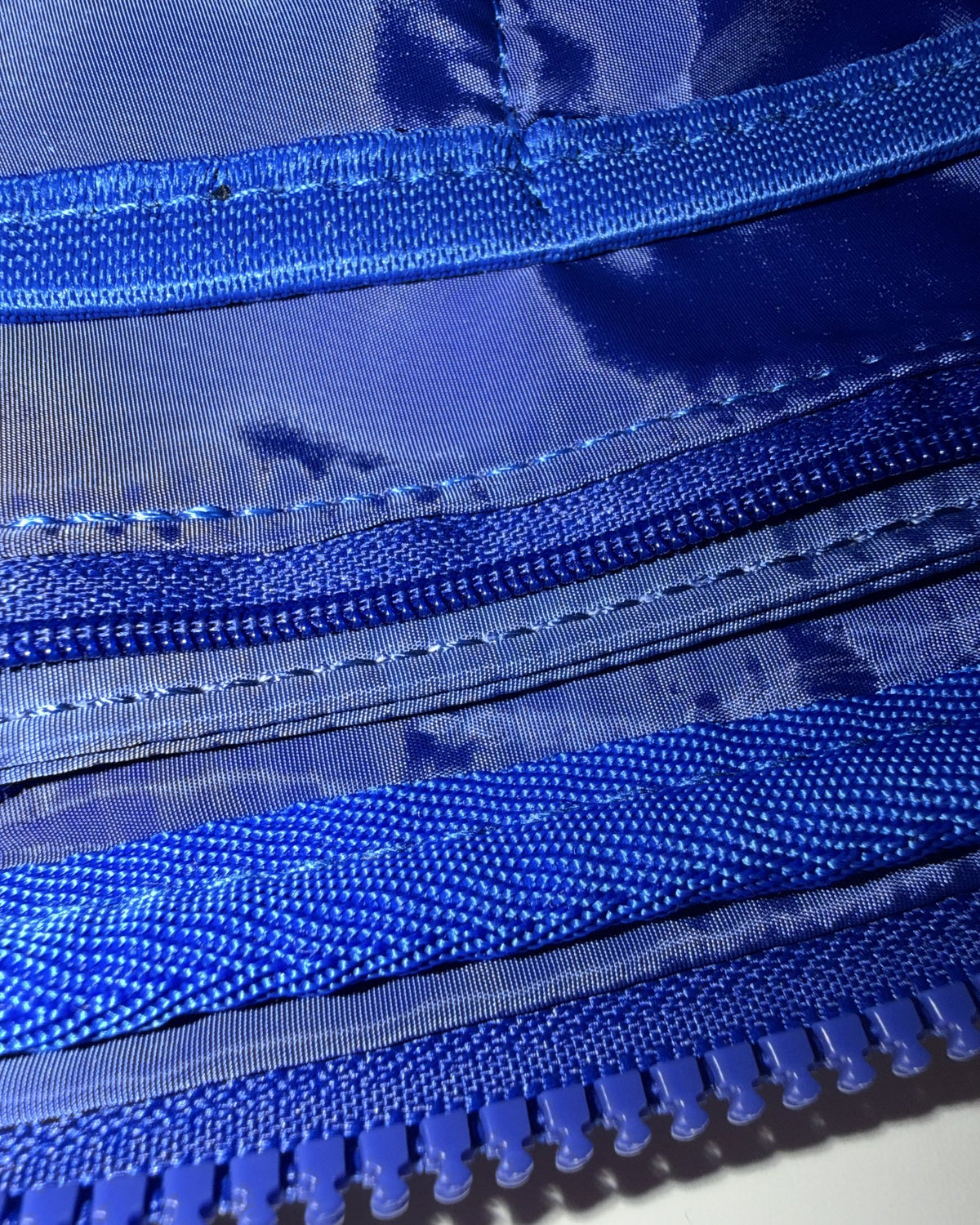 Inside the Cobalt A5 crossbody bag, lining and zip pockets