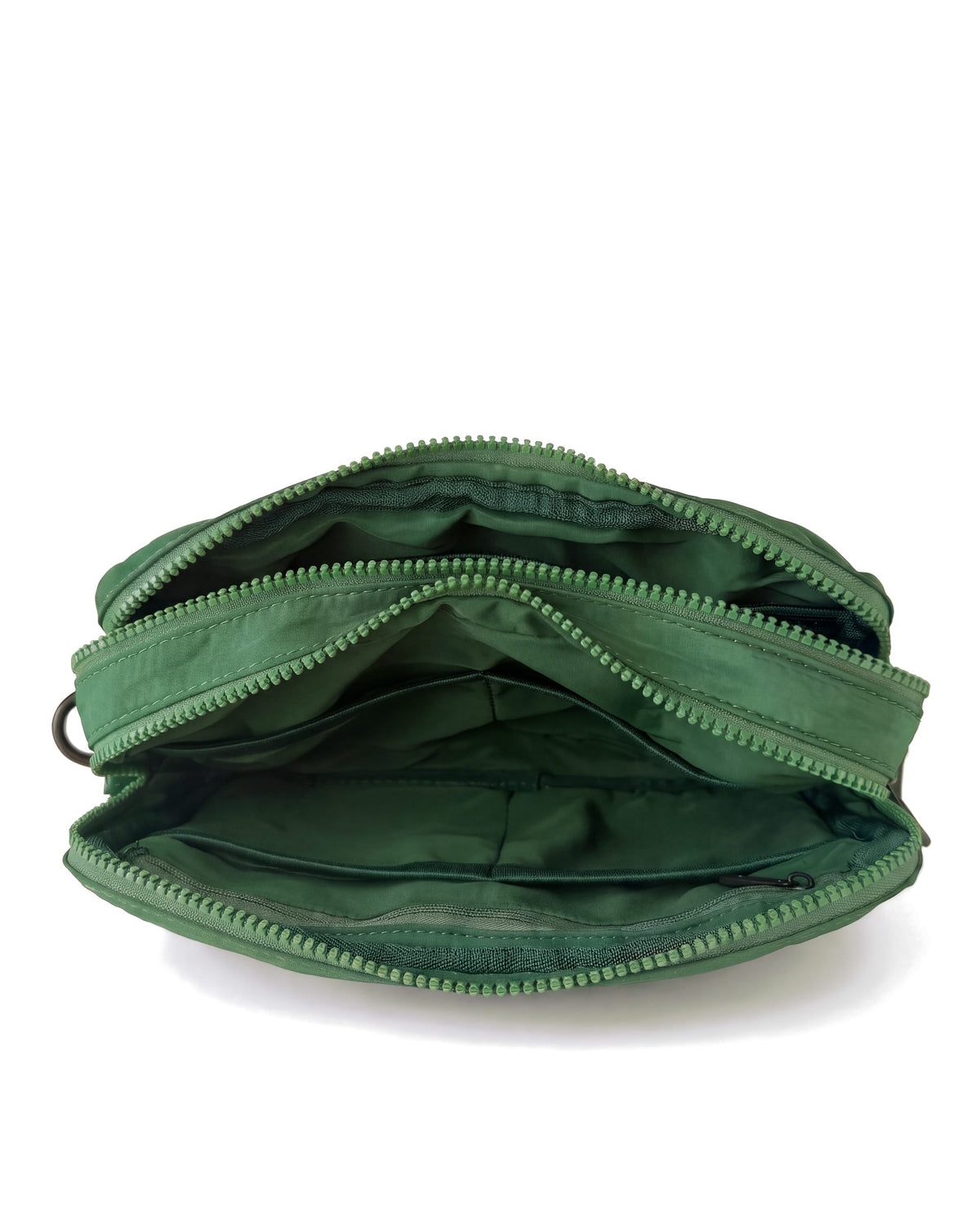 Forest A5 crossbody bag with the main zip open, pockets showing