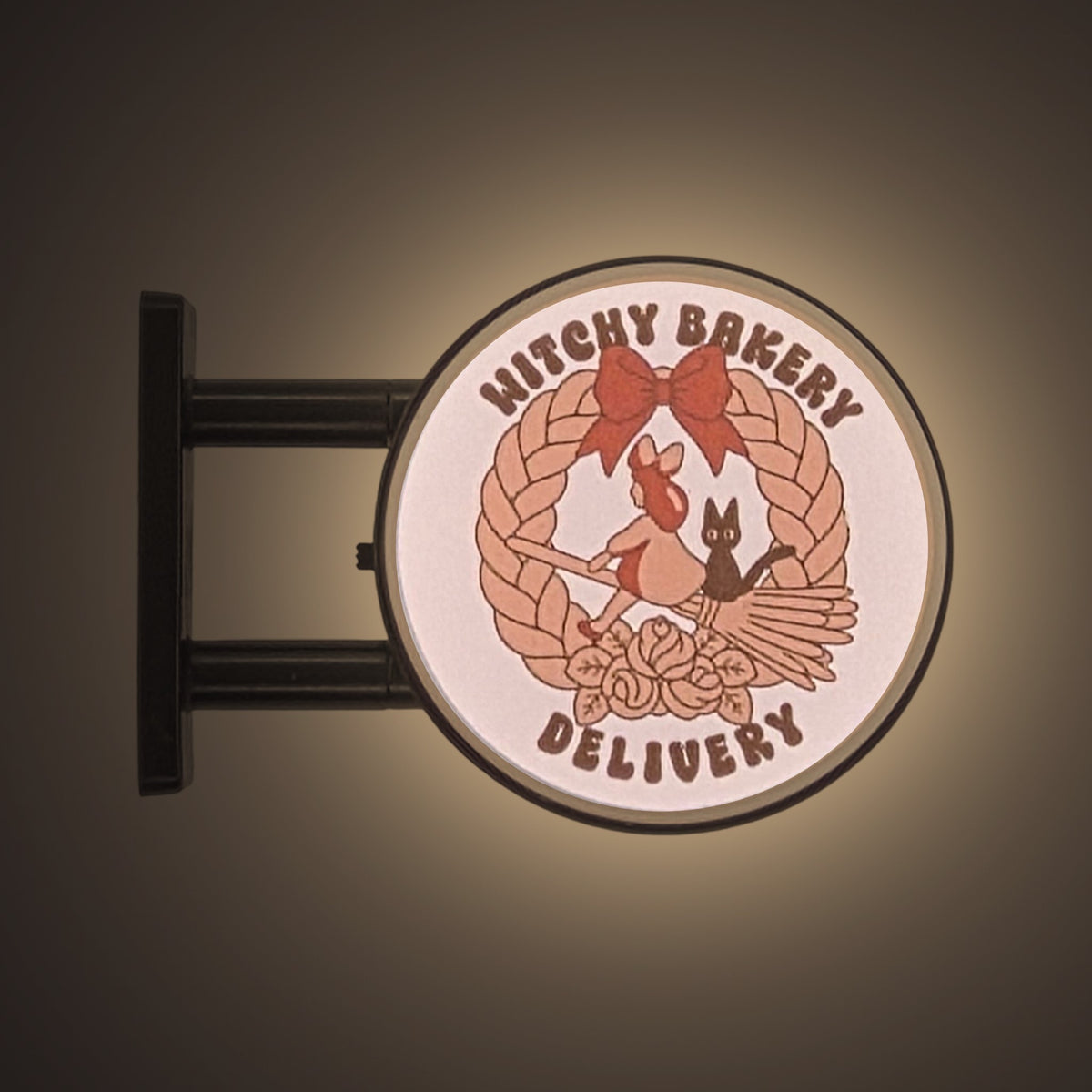 Bakery Delivery Magnet Light by Pinbuds, lit up in the dark
