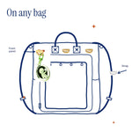 D-Ring Pins (2-Pack) by Pinbuds, on a bag front panel and strap