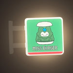 Moss Burger Magnet Light by Pinbuds, lit up in the dark