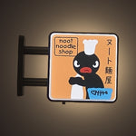 Noot Noodle Magnet Light by Pinbuds, lit up in the dark