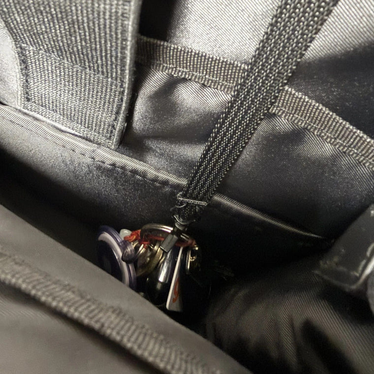 Keys clipped inside the 3-Way Shapeshift Backpack on the key strap with a lobster clasp
