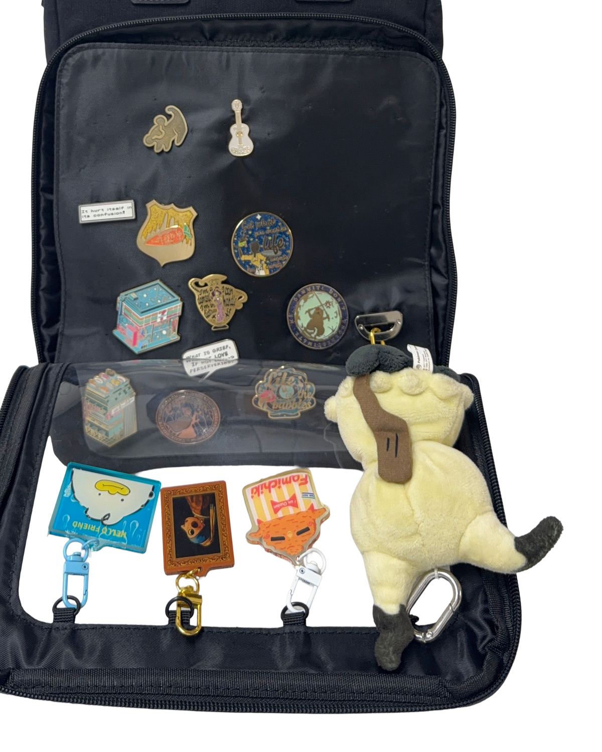 Cotton Convertible ITA Bag 15", black: pin pad panel open with pins and charms on the D-rings, cut out