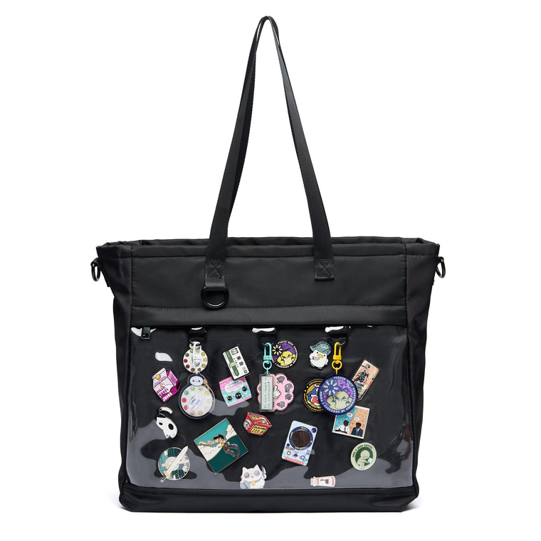 16" ITA laptop tote in black, pin window filled with pins and charms, carried by its top handles