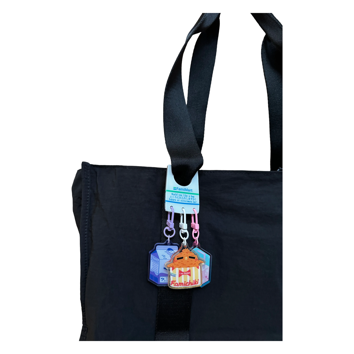 Blue Bread Clip by Pinbuds, acrylic clip holding charms on a tote strap