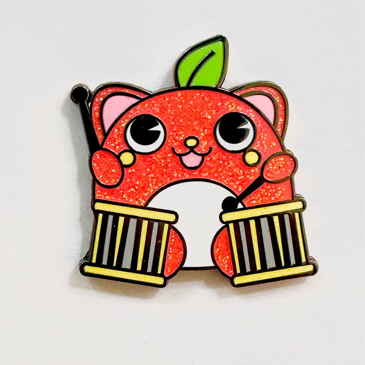 Apple Drummer Bear Mascot enamel pin, black plating