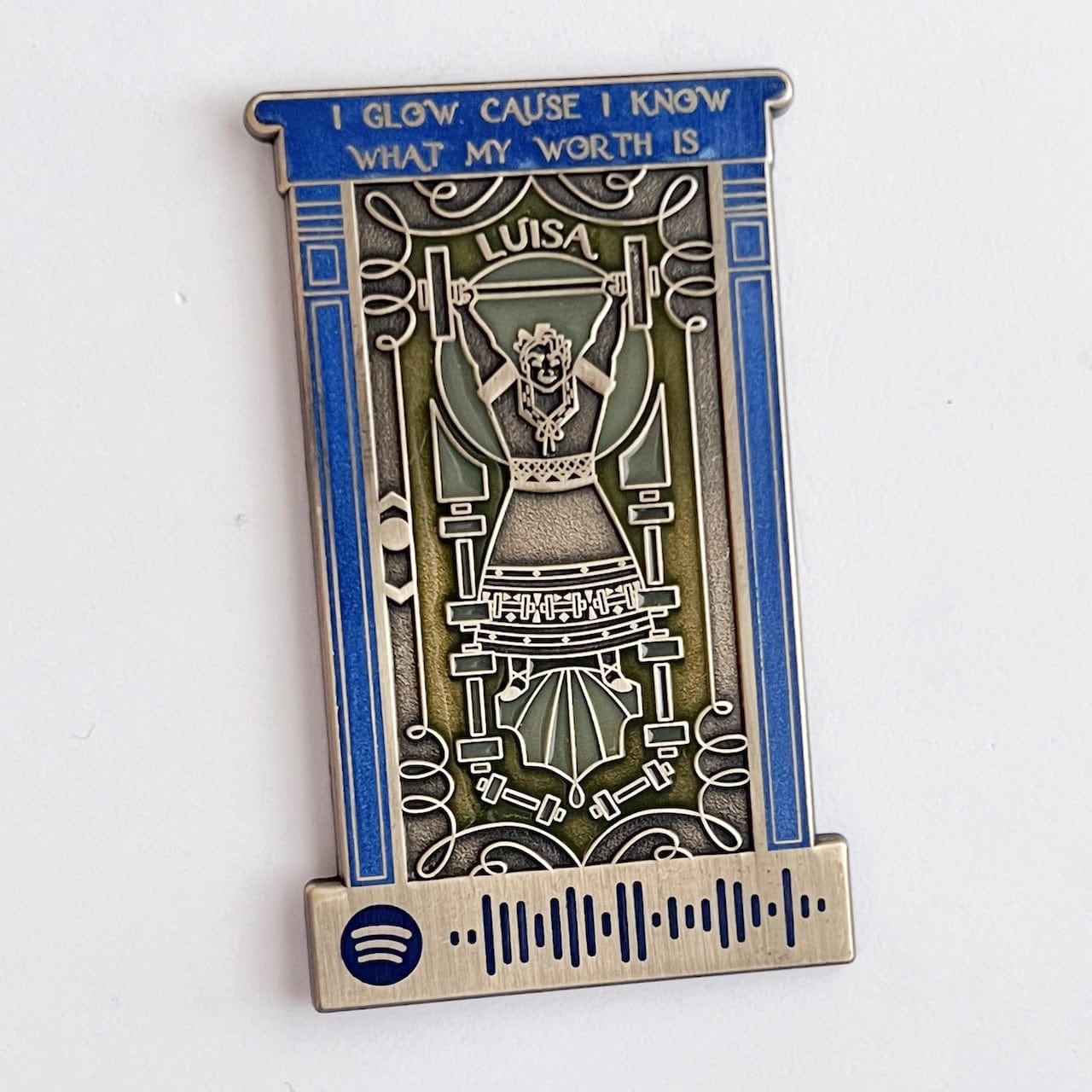 Pinbuds Enamel pin Luisa's door pin (Features Spotify code that plays Surface pressure from Encanto)