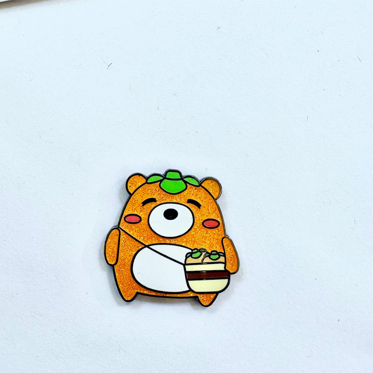 Persimmon Bear Mascot enamel pin, black plating