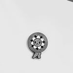 Sexy Tile Mascot enamel pin, black plating