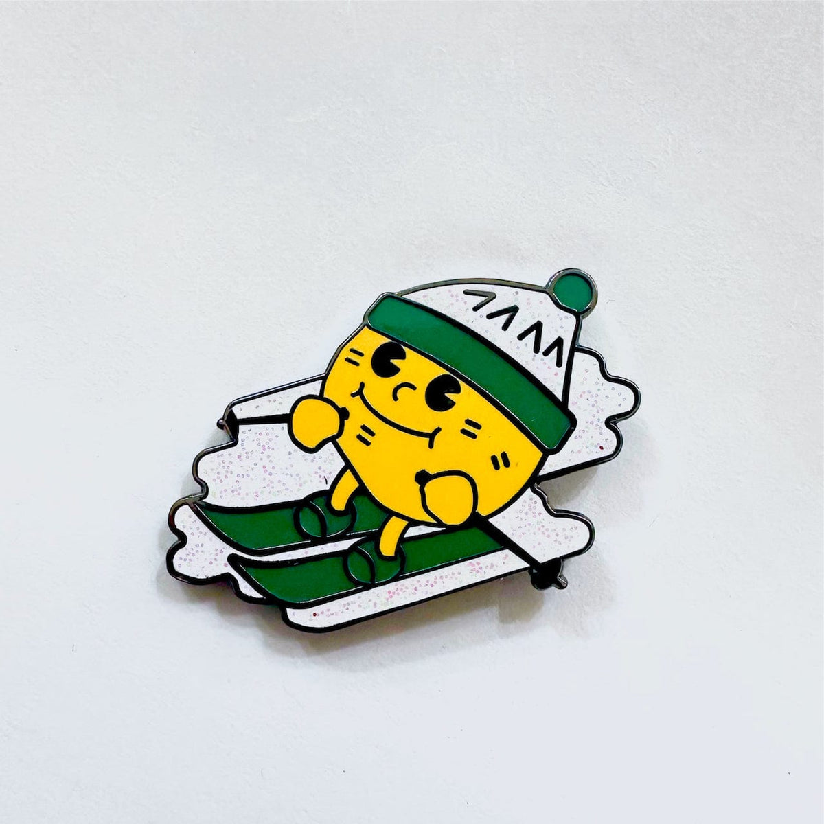 Skiing Potato Mascot enamel pin, black plating