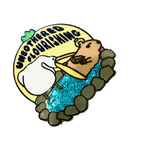 Unbothered Capybara with a Gun enamel pin, black plating