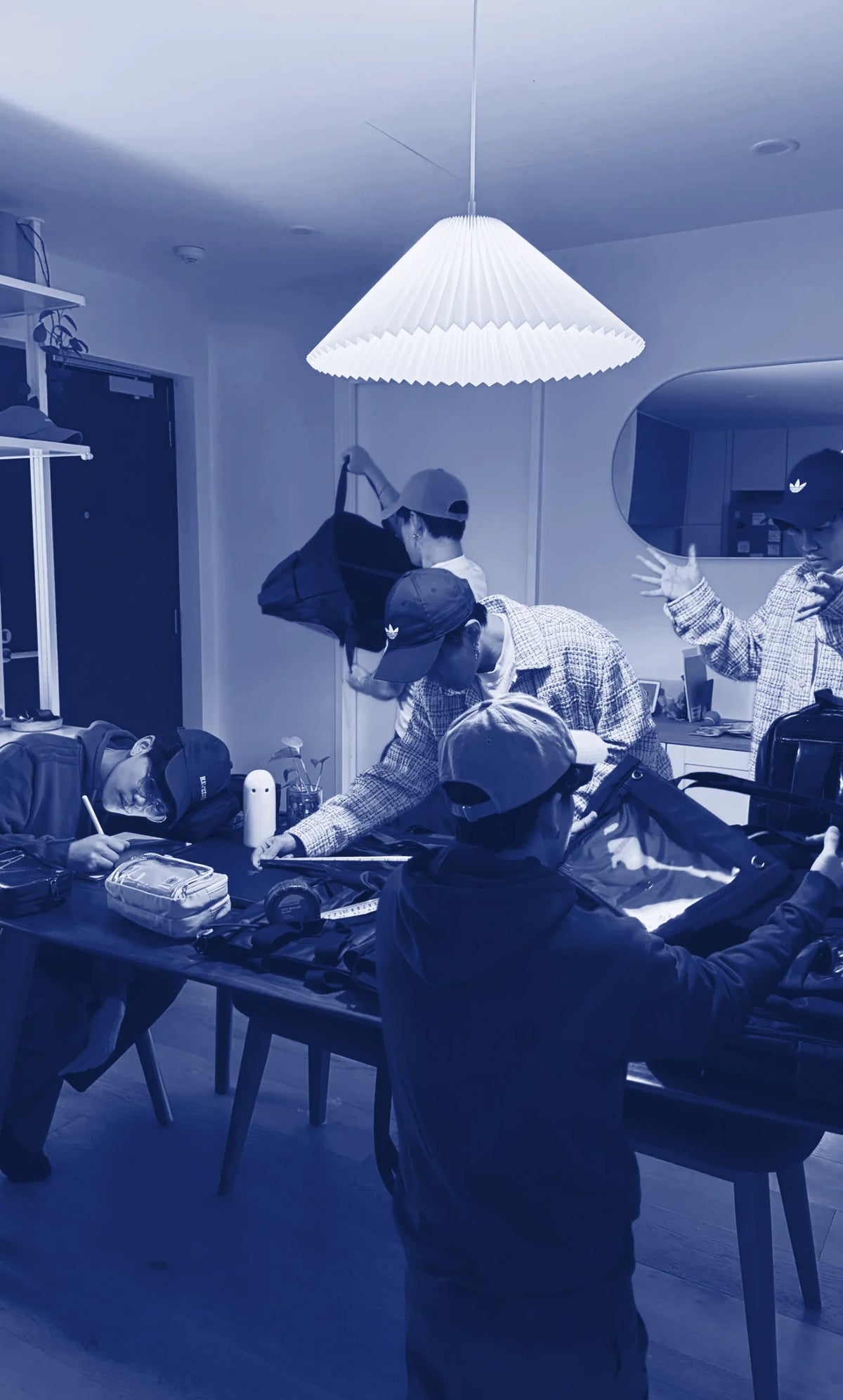 The Pinbuds team measuring and testing ITA bags around a table