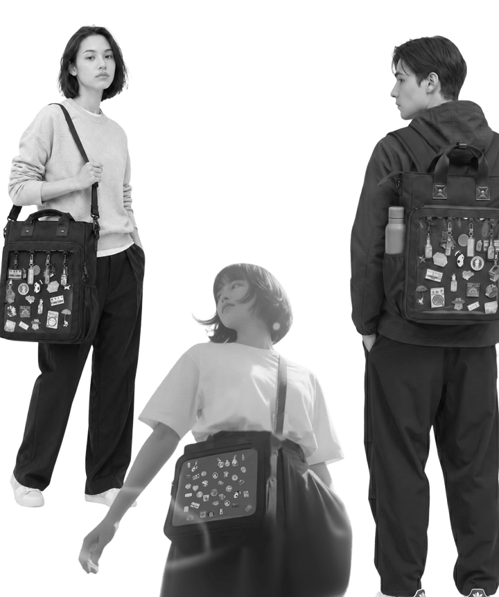 Three people wearing the Pinbuds 15 inch 3-Way Cotton ITA bag, filled with pins