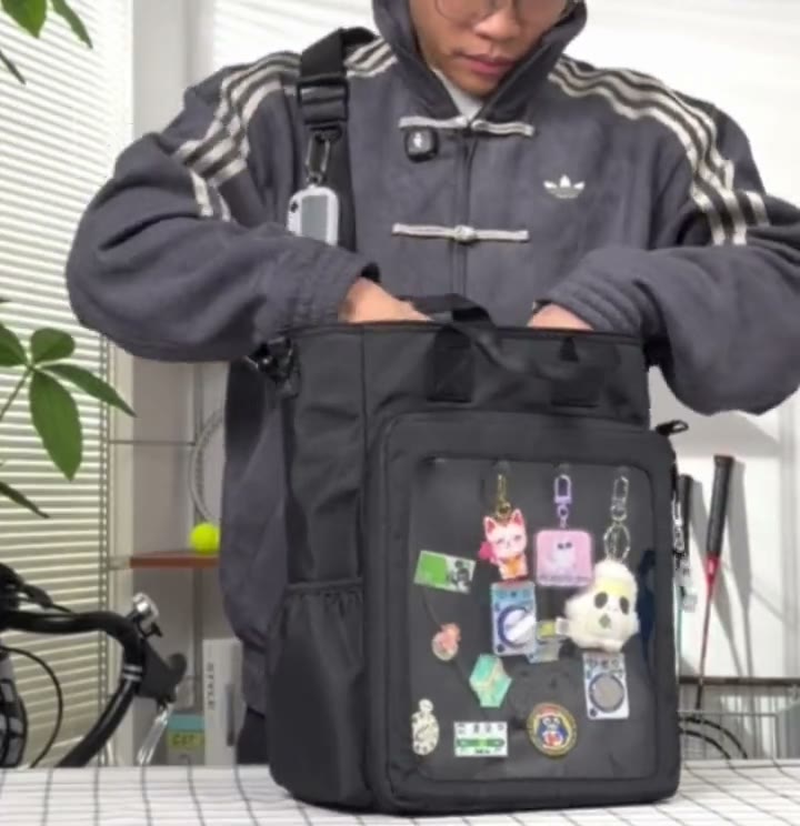 Sliding a laptop up to 15 inch and a water bottle into the 15 inch Cotton ITA bag