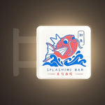Splashimi Magnet Light by Pinbuds, lit up in the dark