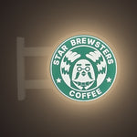 StarBrewsters Magnet Light by Pinbuds, lit up in the dark